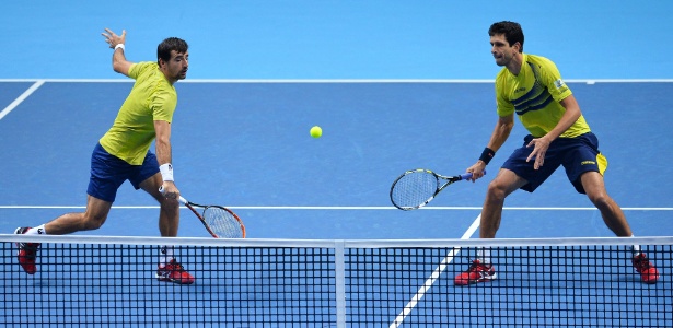 Marcelo Melo e Ivan Dodig em ação nas Finais da ATP - Glyn Kirk/AFP Photo