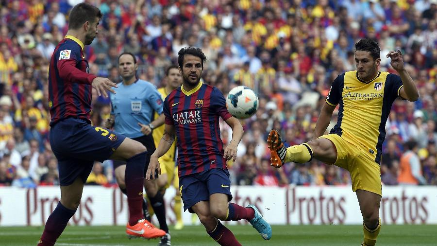 Barcelona e Atlético de Madri decidiram o Campeonato Espanhol em 2014 na última rodada - AFP PHOTO/ LLUIS GENE
