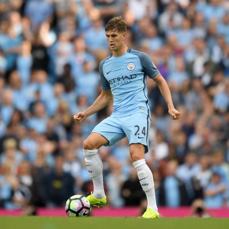 John Stones em ação com a camisa do Manchester City - Stu Forster/Getty Images