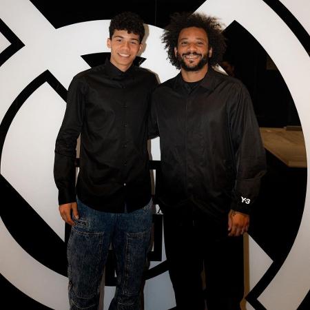 Enzo, atacante do sub-15 do Real Madrid, ao lado de Marcelo