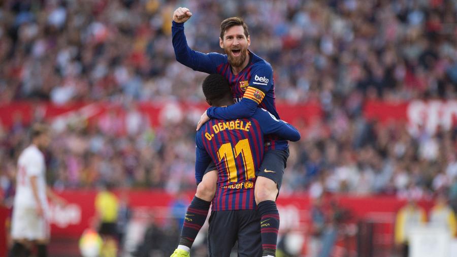 Messi fez três gols contra o Sevilla - JORGE GUERRERO / AFP