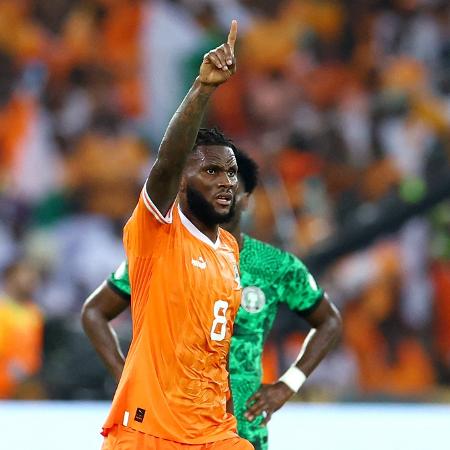Kessié, da Costa do Marfim, comemora após marcar contra a Nigéria, na final da Copa Africana Kessié, da Costa do Marfim, comemora após marcar contra a Nigéria, na final da Copa Africana