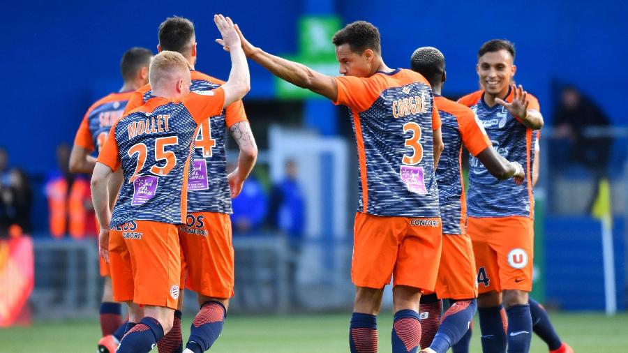 Jogadores do Montpellier comemoram vitória sobre o PSG - Pascal GUYOT / AFP