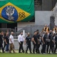 Edinho, the king's son, and former Santos outfit Roberto carry Pele's coffin at Villa Belmero - Marcelo Justo/UOL