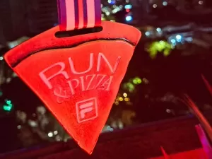 5 km e 113 pizzas: Fila mistura corrida com comida em evento com famosos