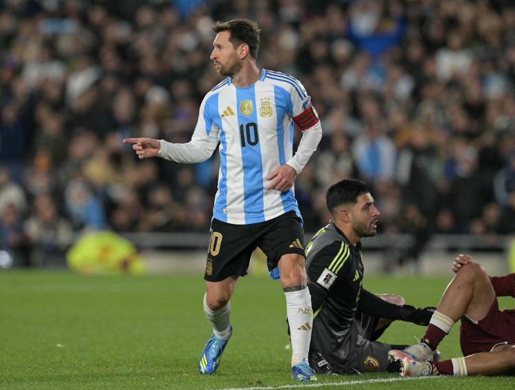 Argentina's Messi celebrates scoring against Venezuela in the qualifying match