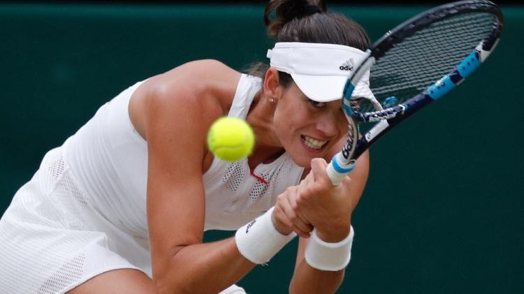 muguruza - AFP PHOTO / Adrian DENNIS - AFP PHOTO / Adrian DENNIS