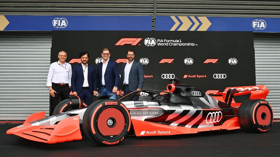 Os chefes da F1, da FIA e da Audi no anúncio de que a montadora entrará na F1 em 2026 - Divulgação