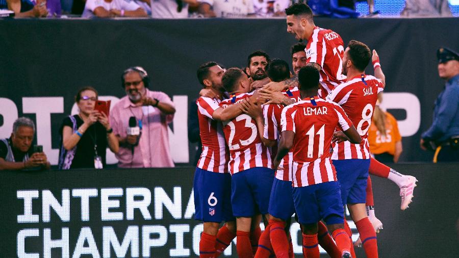 Jogadores do Atlético de Madri comemoram gol contra o Real Madrid - Johannes EISELE / AFP