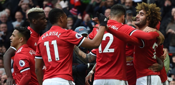 Jogadores do United comemoram gol da vitória sobre o Arsenal - AFP PHOTO / PAUL ELLIS