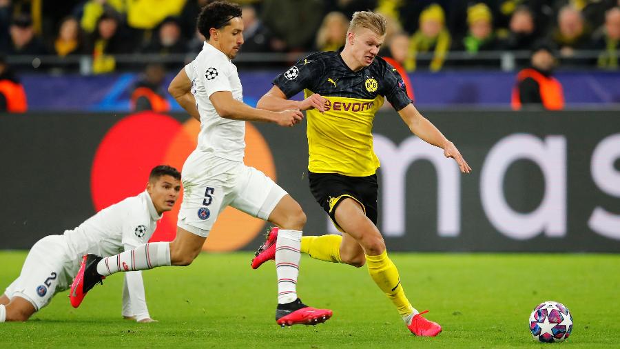 Marquinhos, do PSG, junto ao atacante Haaland, do Borussia Dortmund,no jogo de ida pelas oitavas de final da Liga dos Campeões - Wolfgang Rattay/Reuters