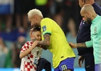 Filho de jogador croata consola Neymar após eliminação do Brasil na Copa - Adrian DENNIS / AFP