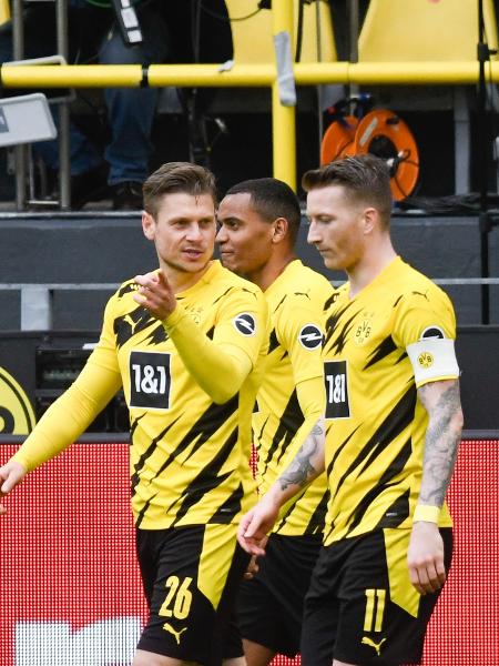 Jason Sancho comemora gol do Borussia Dortmund em partida do Campeonato Alemão 2020-21 - Bernd Thissen/picture alliance via Getty Images