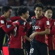 Kashima Antlers comemora o empate contra o Real Madrid no final do primeiro tempo - Behrouz Mehri/AFP