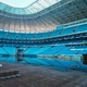 Arena do Grêmio segue alagada, mas gramado começa a aparecer; veja imagens