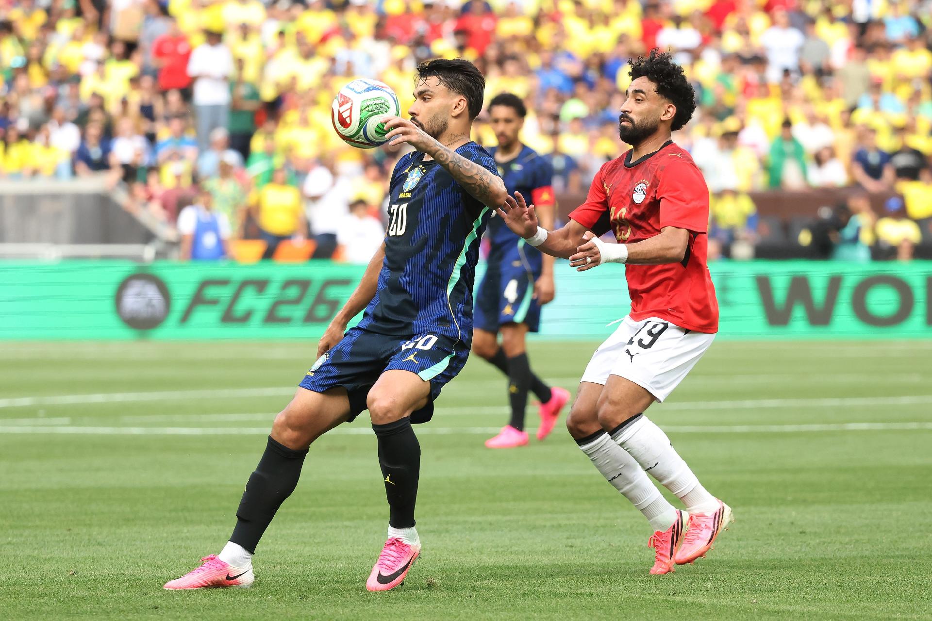 CLEVELAND, OHIO - JUNE 06: Lucas Paquetá of Brazil competes for the ball against Marawan Attia of Egypt during the international friendly match between Brazil and Egypt at Huntington Bank Field on June 06, 2026 in Cleveland, Ohio. (Photo by Kirk Irwin/Getty Images) - undefined