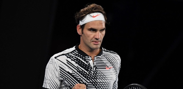 Federer comemora ponto contra Nadal - AFP PHOTO / GREG WOOD