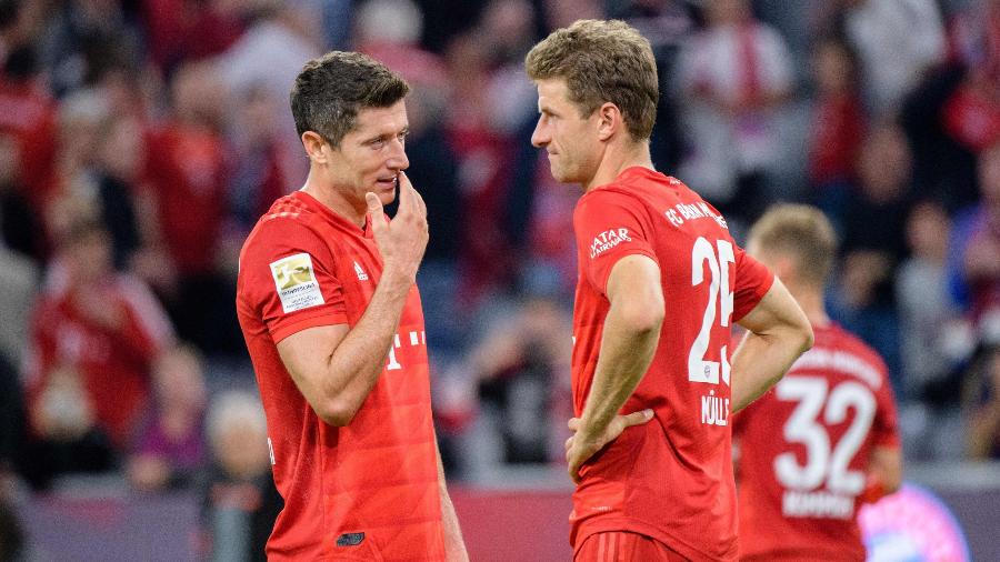 Lewandowski e Muller reagem após empate entre Bayern de Munique e Hertha Berlim - Matthias Balk / dpa / AFP