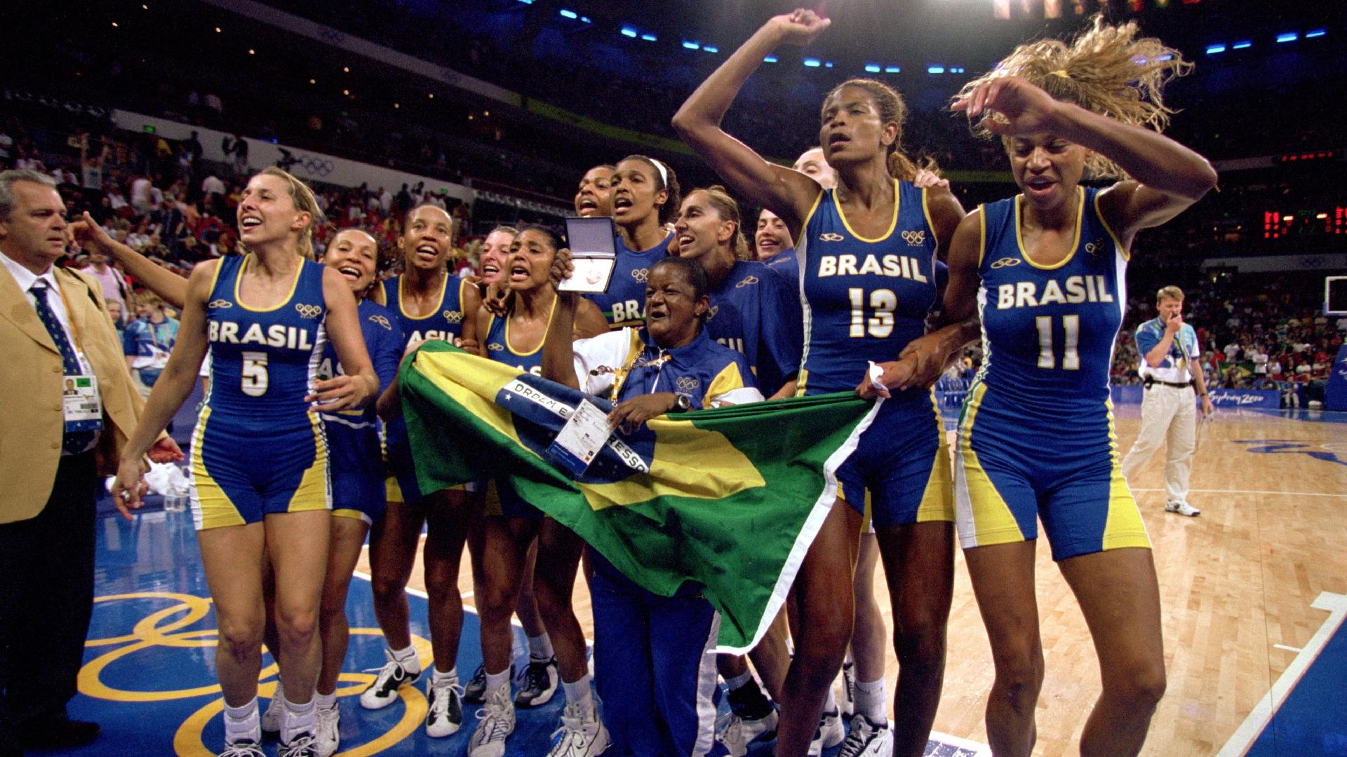 SYDNEY - SEPTEMBER 30: Team Brazil celebrates capturing the bronze after the women's basketball medal game against Korea at the Sydney SuperDome during the Sydney Olympic Games in Sydney, Australia on September 30, 2000. Brazil defeated Korea in overtime 84-73. (Photo by Jamie Squire /Getty Images) 