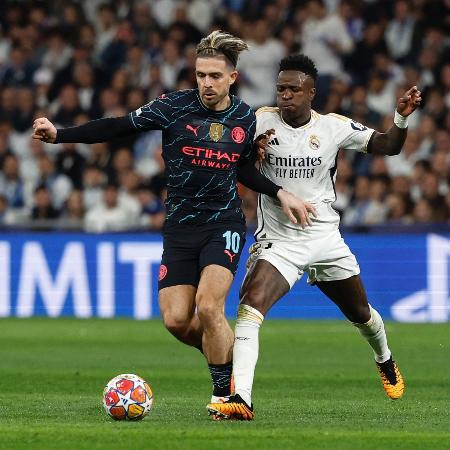 Vinicius Jr e Grealish em ação no Real Madrid x Manchester City das quartas da Champions