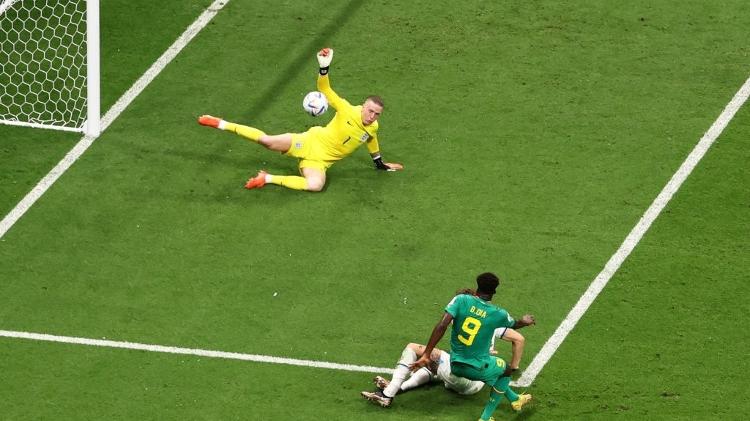 England goalkeeper Pickford saves Boulaye Dia's shot during a World Cup match against Senegal - Robert Cianflone/Getty Images - Robert Cianflone/Getty Images