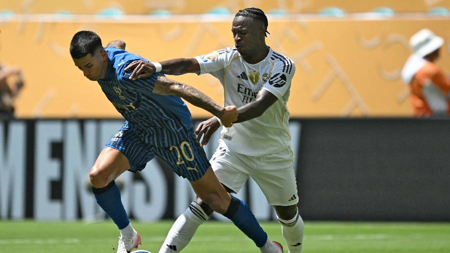 Vinícius Júnior e João Cancelo em ação durante jogo entre Real Madrid e Al-Hilal no Mundial