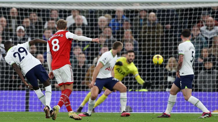 Odegaard strikes from outside the box to score Arsenal's second goal against Tottenham - ADRIAN DENNIS / AFP - ADRIAN DENNIS / AFP