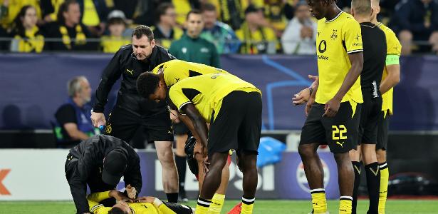 Jogador do Borussia Dortmund passa mal e deixa campo de maca em jogo da Liga dos Campeões