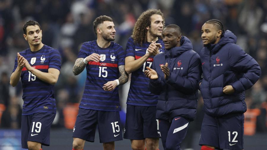 25.3.22 - Jogadores franceses celebram vitória sobre a Costa do Marfim em amistoso internacional - BENOIT TESSIER/REUTERS
