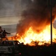 Commissioners put out fire after Romain Grosjean crash in Bahrain - Bryn Lennon / Getty Images