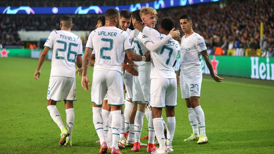 Jogadores do Manchester City comemoram goleada contra o Club Brugge pela Liga dos Campeões  - Julian Finney/Getty Images