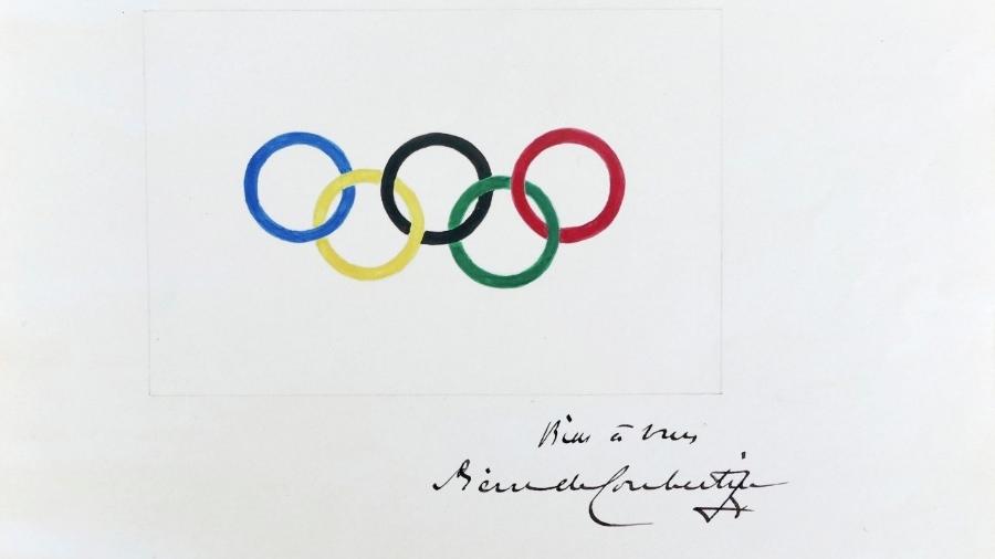 Este é o desenho original dos anéis olímpicos, feito à mão pelo Barão de Coubertin, criador dos jogos da era moderna. Será que ele valeria medalha nas competições de artes olímpicas que começaram a ser disputadas nos jogos de Estocolmo 1912? - Divulgação