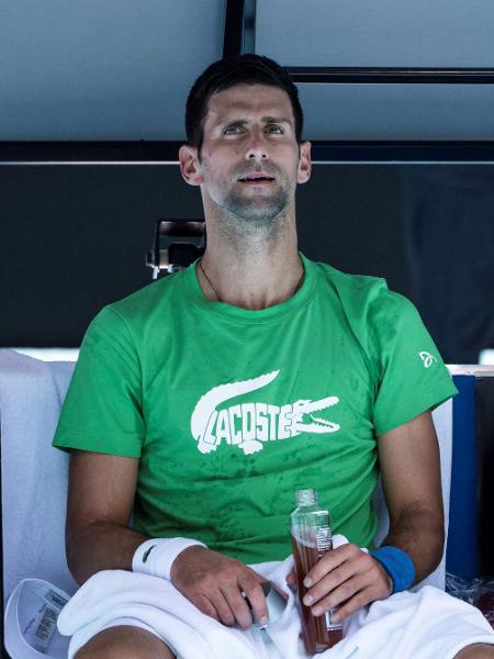 Novak Djokovic, durante treino antes do Australian Open - Mike FREY / AFP
