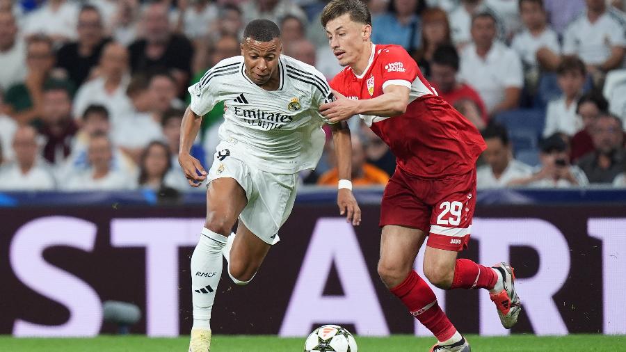 Mbappé é marcado por Rouault durante jogo entre Real Madrid e Stuttgart pela Champions League