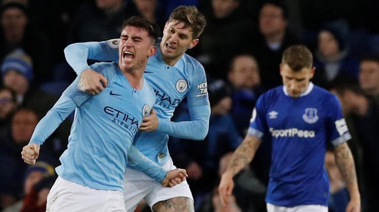 Laporte Stones Manchester City - Phil Noble/Reuters - Phil Noble/Reuters