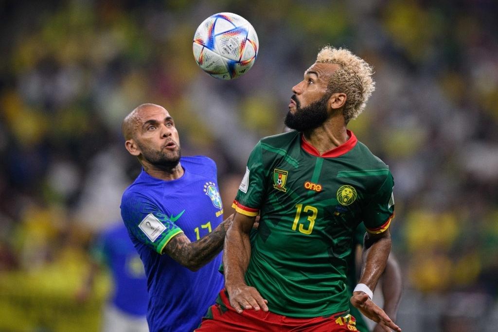 Dani Alves of Brazil disputes the ball with Choupo-Moting of Cameroon during a World Cup match - Markus Gilliar - GES Sportfoto/Getty Images