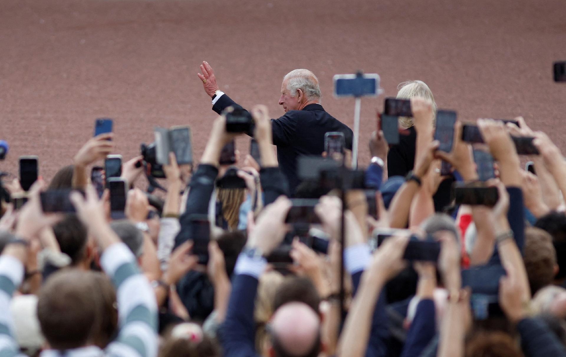 Charles was accompanied by supporters - and their cell phones - when he arrived at the palace - JOHN SIBLEY/REUTERS