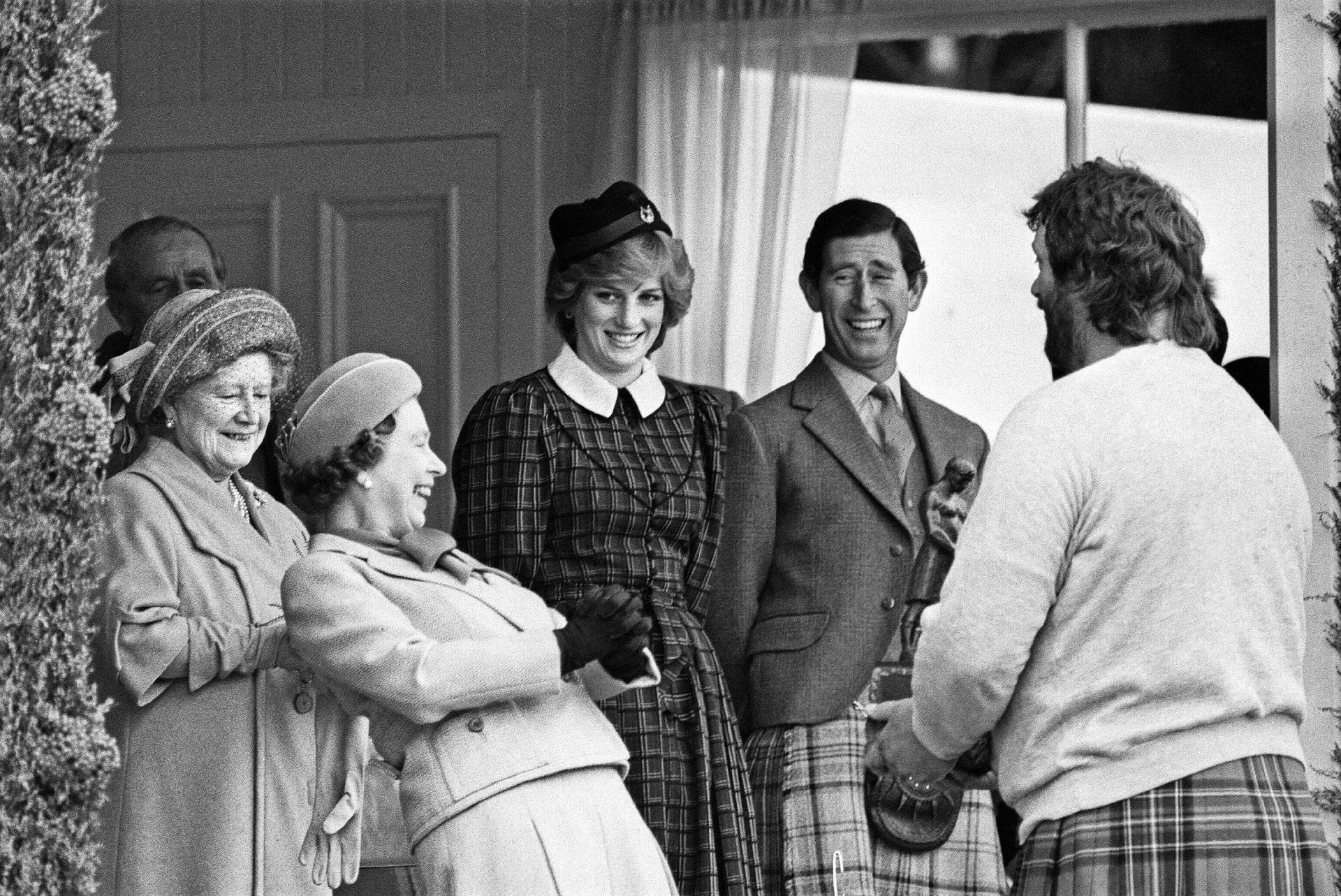 Queen Elizabeth II laughs with family at an event in Scotland in 1982. - Getty Images