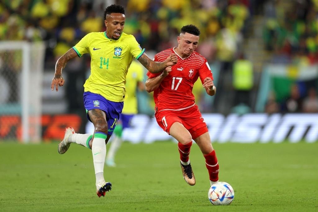 Éder Militão of Brazil and Ruben Vargas of Switzerland compete for the ball during a World Cup match - Clive Brunskill/Getty Images