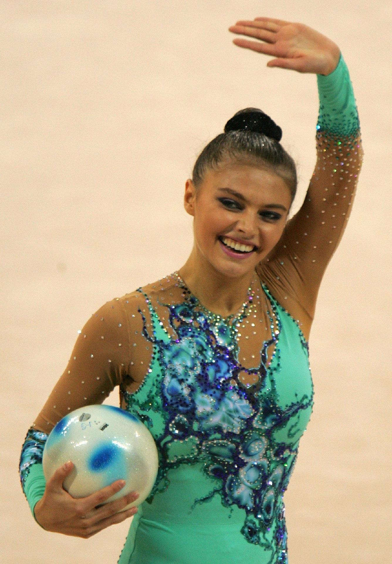 Aug 26, 2004 - Alina Kabaeva waving after performing at the Olympic Games in Athens, Greece - Kimimasa Mayama/Reuters