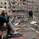 Apr 18.22 - Residents gather in a courtyard near an apartment block badly damaged during the Ukraine-Russia conflict in the port city of Mariupol in southern Ukraine - ALEXANDER ERMOCHENKO/REUTERS