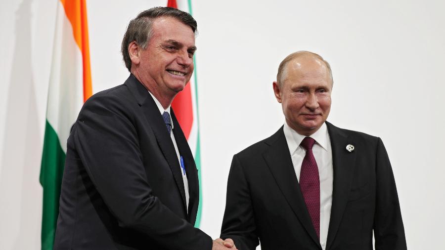 Presidente Jair Bolsonaro, do Brasil, e presidente Vladimir Putin, da Rússia, durante Encontro do G20, em 2019 - Mikhail KLIMENTYEV / AFP