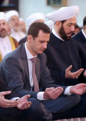O ditador sírio, Bashar al-Assad (de terno) - Agência de notícias da Síria/Reuters