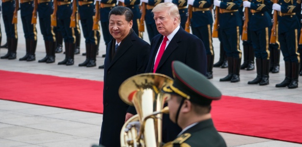 O presidente chinês, Xi Jinping, recebe seu colega dos Estados Unidos, Donald Trump, em visita à China - DOUG MILLS/NYT