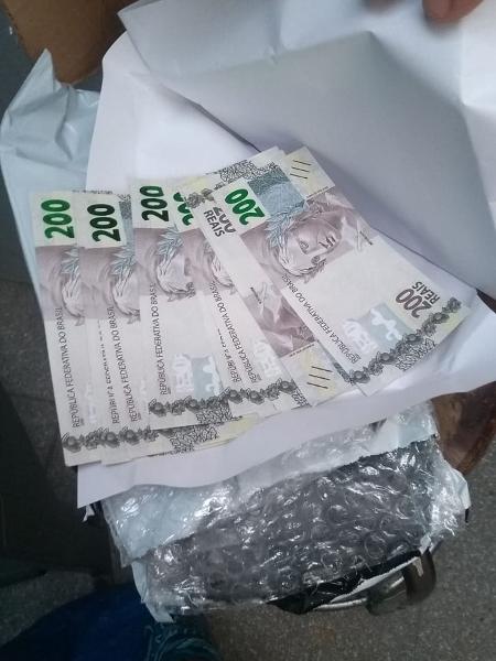 Policiais apreenderam grande quantidade de notas falsas - Divulgação/Polícia Federal