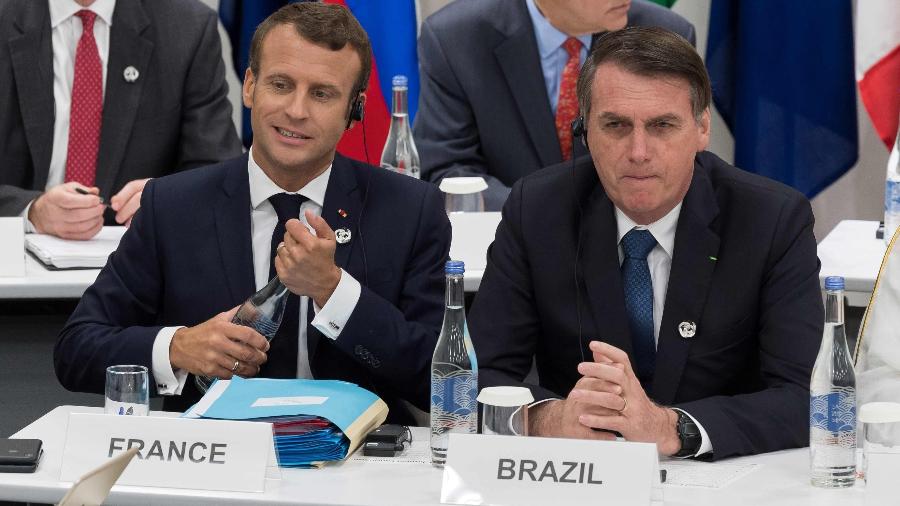 Os presidentes Emmanuel Macron (França)  e Jair Bolsonaro (Brasil) - Jacques Witt - 28.jun.2019/AFP