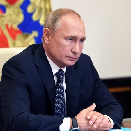 Vladimir Putin durante videoconferência de anúncio de registro da vacina Sputnik V - ALEXEY NIKOLSKY/AFP