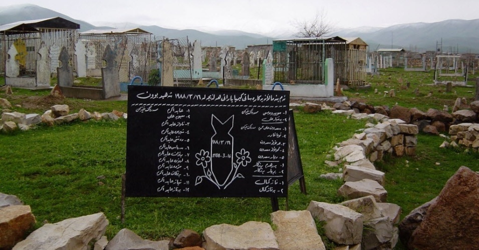 The sign on a grave lists members of a single family killed when Saddam Hussein's forces dropped chemical bombs, including mustard gas and nerve agents, on the northern Iraq town of Halabja, near the Iranian border, March 14, 2003. Around 5,000 people died in the attack on March 16, 1988. The people of Halabja are calling on the United States to topple Saddam as the world agonises over whether to go to war with Baghdad or not