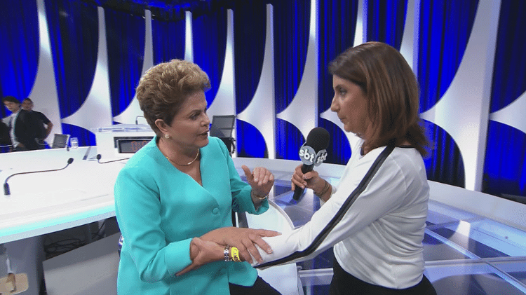 Enquanto concedia entrevista ao vivo para o SBT, Dilma teve uma queda de pressão e teve de ser amparada pela repórter