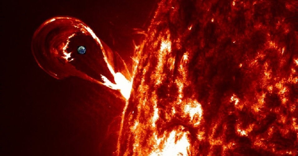23.out.2014 - Imagem da Nasa (agência espacial americana) mostra erupção solar com a Terra aparecendo próxima do Sol, à esquerda. Um modelo desenvolvido pelo astrofísico Tahar Amari e sua equipe mostra que um campo magnético é formado na atmosfera do Sol pouco antes de uma grande tempestade solar, o que pode contribuir para prever erupções solares
